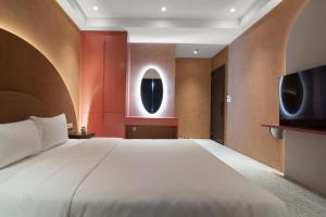 Postel nebo postele na pokoji v ubytování Jacayl Hotel HD