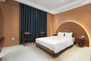Postel nebo postele na pokoji v ubytování Jacayl Hotel HD