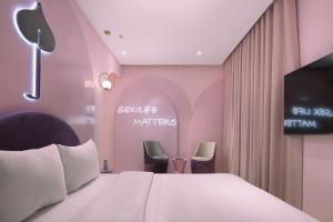 Postel nebo postele na pokoji v ubytování Jacayl Hotel HD