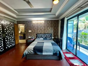 Postel nebo postele na pokoji v ubytování Fernandes Homestay- Amor