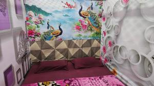a bedroom with a bed in a room with flowers at Vrindavan Nivas -Near Prem mandir bankey bihari in Vrindāvan