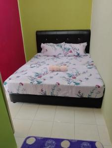 Postelja oz. postelje v sobi nastanitve Irman Homestay Pendang