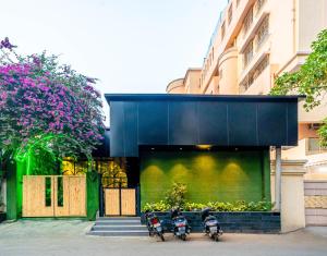 two motorcycles parked in front of a building at Treebo Trend Express Inn in Mumbai