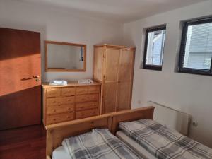 A bed or beds in a room at Chalet Montagne Bansko apartment