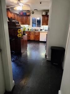 a kitchen with wooden cabinets and a counter top at Cozy, spacious and peaceful in Providence