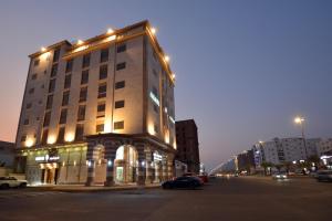 a large building with lights on the side of a street at فندق المرزم-Al Marzam Hotel in Al Madinah