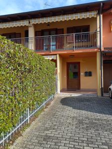 a house with a brick driveway in front of it at Matteotti 21 in Occhieppo Inferiore
