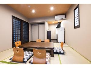 a kitchen with a table and chairs in a room at BEPPU NO YU SORA - Vacation STAY 87966 in Beppu