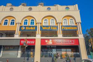 a large building with a west inn terminal at Hotel West Inn Premium in Kharar