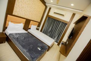 Postel nebo postele na pokoji v ubytování THE PARK AVENUE HOTEL - Business Class Hotel Near Central Railway Station Chennai Periyamet