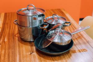 a group of pots and pans on a table at Yuzawa Onsen Lodge 1min to LIFT House in Seki