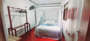 Ένα ή περισσότερα κρεβάτια σε δωμάτιο στο Bamboo Home stay Hiriketiya