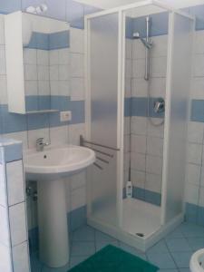 a bathroom with a sink and a shower at Le Ninfe Bed and Breakfast in Anzio +36 photos