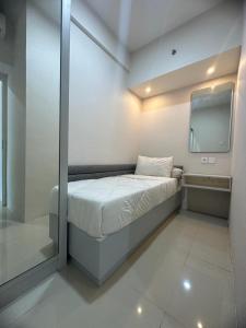 Ein Bett oder Betten in einem Zimmer der Unterkunft Tanglin Orchard Apartment by Kondoku
