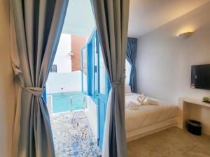 Voodi või voodid majutusasutuse Ipoh Santorini Hideaway - Hotel Inspired toas