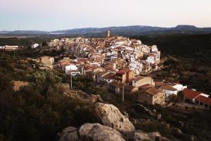 a small town on a hill with houses at Ca Pelegrí in Useras