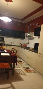 A kitchen or kitchenette at El Giardino delle Rose.....