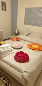 A bed or beds in a room at El Giardino delle Rose.....