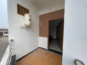 an empty room with a boiler on the wall at Rukmani Villas Group of Rukmani home stay in Mathura