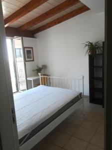 a bedroom with a large bed in a room at Benedetto Cairoli Guest House in Bari