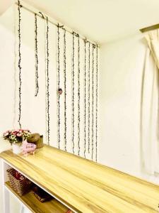 a room with a shelf with chains on the wall at Free & Easy Leisure Homestay in Batu Caves