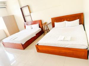 Postel nebo postele na pokoji v ubytování 158A Hotel
