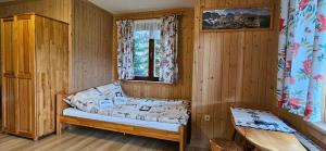 Una cama o camas en una habitación de PG Szymonek