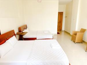 Postel nebo postele na pokoji v ubytování 158A Hotel