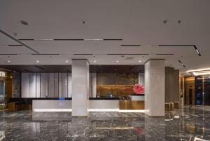 Lobbyn eller receptionsområdet på Howard Johnson Paragon Hotel Beijing Central