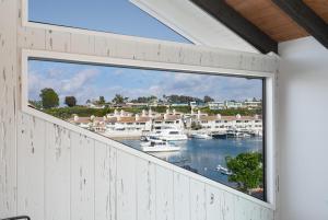 a window in a house with a view of a harbor at 1011 North Bayfront B in Newport Beach