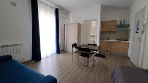 a living room with a couch and a table and chairs at Le Due Sicilie B&B in Lascari