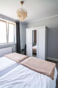 Posteľ alebo postele v izbe v ubytovaní Apartamenty Algador
