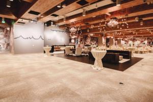 a large room with tables and chairs in it at Whitney Peak Hotel Reno, Tapestry Collection by Hilton in Reno