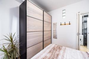 Ένα ή περισσότερα κρεβάτια σε δωμάτιο στο The Base - Comfort a Milano