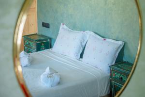 Postel nebo postele na pokoji v ubytování Villa Alhambra Rouge