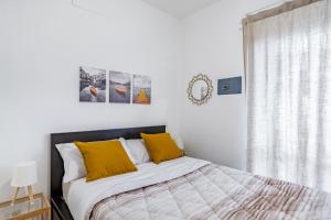 Ένα ή περισσότερα κρεβάτια σε δωμάτιο στο The Base - Comfort a Milano