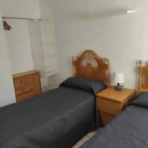 Кровать или кровати в номере Apartamento Altomira