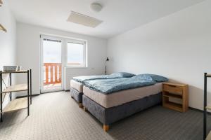 Postel nebo postele na pokoji v ubytování APARTMÁN Abertamská Chata
