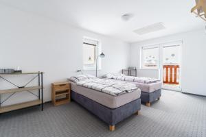 Postel nebo postele na pokoji v ubytování APARTMÁN Abertamská Chata