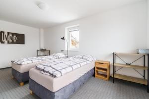 Postel nebo postele na pokoji v ubytování APARTMÁN Abertamská Chata