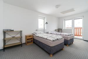 Postel nebo postele na pokoji v ubytování APARTMÁN Abertamská Chata