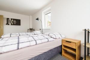 Postel nebo postele na pokoji v ubytování APARTMÁN Abertamská Chata