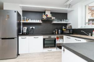 Kuchyň nebo kuchyňský kout v ubytování APARTMÁN Abertamská Chata