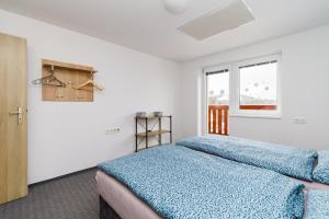 Postel nebo postele na pokoji v ubytování APARTMÁN Abertamská Chata