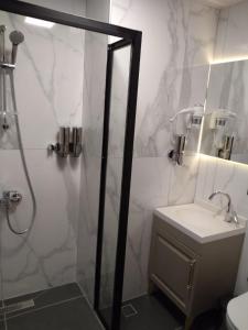 a bathroom with a shower and a sink at Eyüp Sultan Hotel in Istanbul