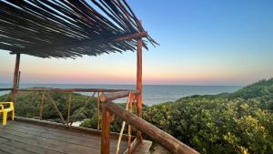 a deck with a view of the ocean at Sunbonani Lodge in Maputo
