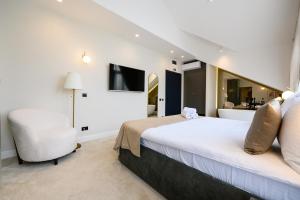 Posteľ alebo postele v izbe v ubytovaní Hotel Bohemian Garni - Skadarlija