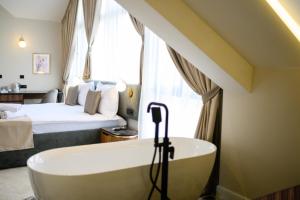 Posteľ alebo postele v izbe v ubytovaní Hotel Bohemian Garni - Skadarlija