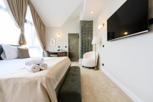 Posteľ alebo postele v izbe v ubytovaní Hotel Bohemian Garni - Skadarlija