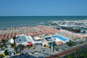 an aerial view of a beach with umbrellas and the ocean at Hotel Gambrinus in Riccione